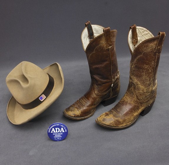 cowboy boots and hat a d a button disability history america