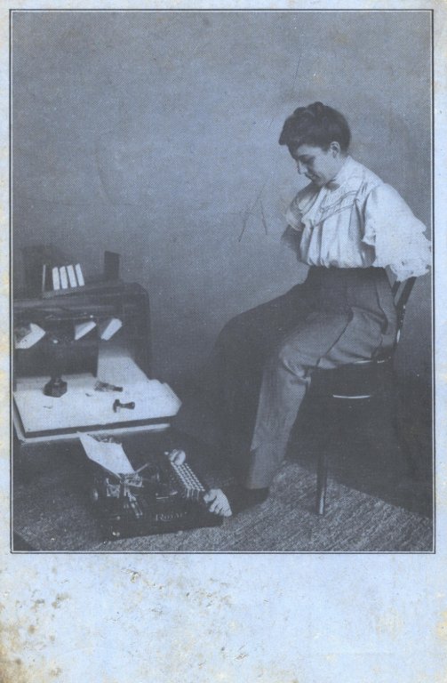 woman typing with feet black white photograph disability history america