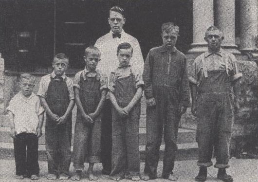 men in file outside black white photograph disability history america