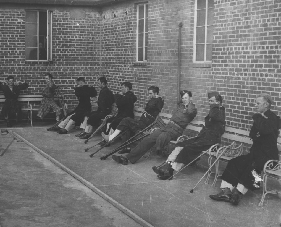male soldiers exercise seated black white photograph disability america