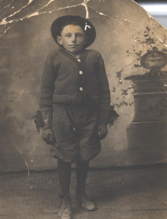 boy in gloves sepia portrait photograph