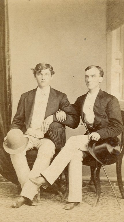 young men seated sepia photograph disability history america