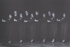 young men and women in file on stage black white photograph disability history america