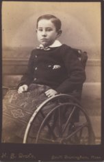 boy in wheelchair sepia photograph disability history america