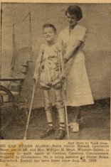 little boy held by female nurse and crutches black white photograph disability history america