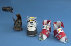 Two sets of shoes made for children whose foot twists inward.